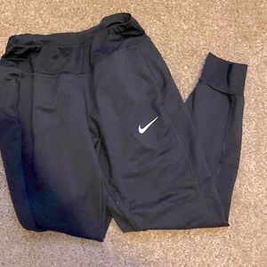 Women’s black Nike joggers.